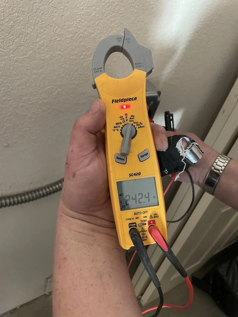Voltage testing with clamp meter during Ceiling Fan Installation in Danbury